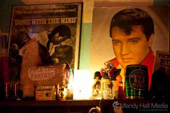 Ephemera in the Old Bar in Fitzroy. Elvis behind the bar and his lookalike sitting at the bar.